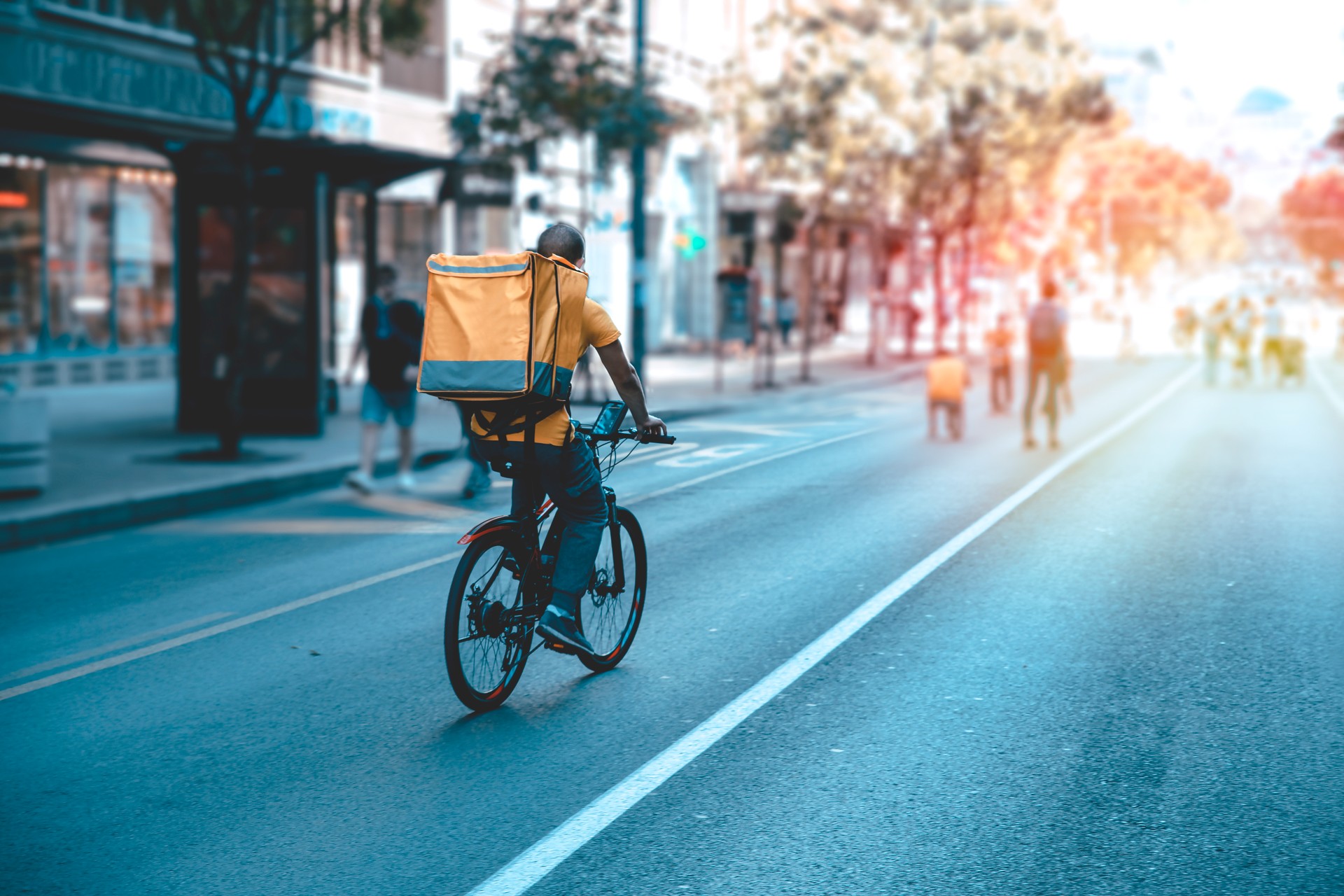 Courier on bicycle with parcel, bike delivery service